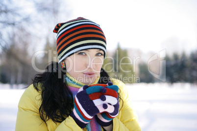 Young Woman in park Holding Mug