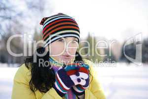 Young Woman in park Holding Mug