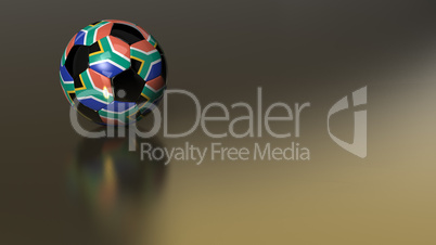 Glossy South African soccer ball on golden metal surface