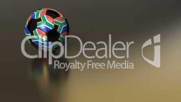Glossy South African soccer ball on golden metal surface