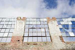 Deteriorating old building with sky