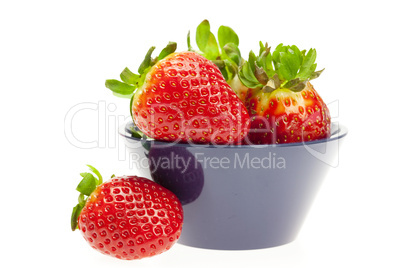 juicy strawberries in a bowl isolated on white