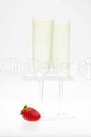 a glass of champagne and strawberries