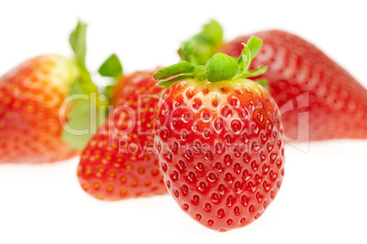 juicy strawberries isolated on white