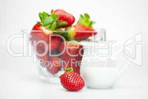 juicy strawberries in a bowl isolated on white