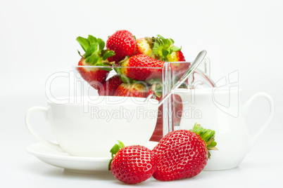 strawberry, white cup and teapot isolated on white