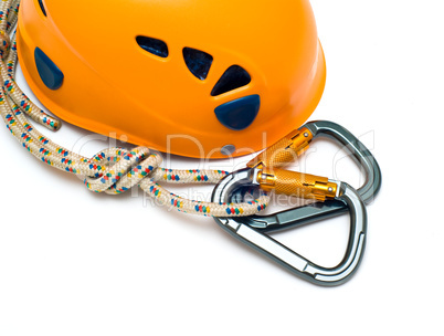 isolated two alpinism carabiners and orange helmet
