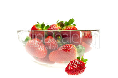 juicy strawberries in a bowl isolated on white