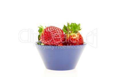 juicy strawberries in a bowl isolated on white