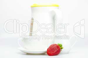 strawberry, white cup and teapot isolated on white