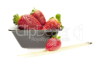 juicy strawberries in a bowl isolated on white