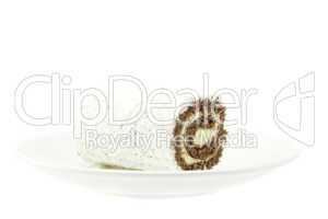 cake roll on a plate isolated on white