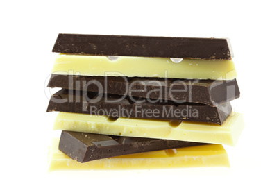 Mount pieces of white and dark chocolate isolated on white