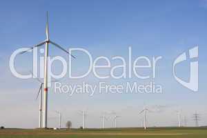 wind turbines under blue sky