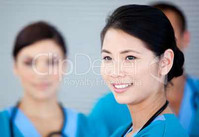 Smiling female doctor with her teamates