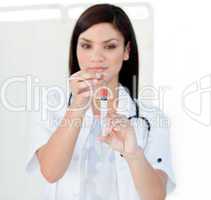 Portrait of a beautiful female doctor preparing a syringe