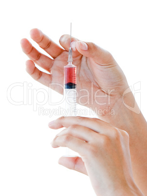 Close-up of a syringe ready for use