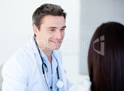 Smiling doctor talking with his patient