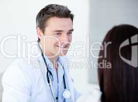 Smiling doctor talking with his patient