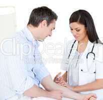 Radiant female doctor making injection to her patient