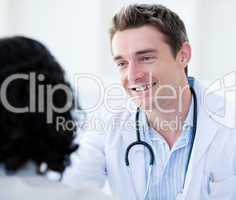 Portrait of a handsome doctor talking with his patient for the a