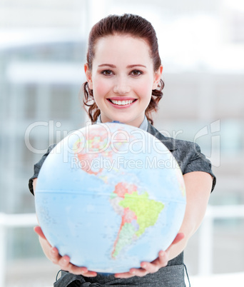 Charismatic businesswoman holding a terrestrial globe