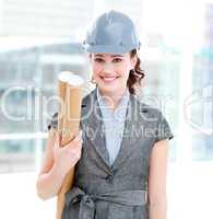 Portrait of a self-assured female architect holding blueprints