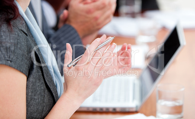 Close-up of business people applauding a good presentation
