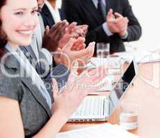 Cheerful business people applauding a good presentation