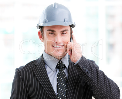 Portrait of a confident male architect on phone