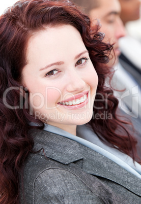 Assertive buinesswoman smiling at the camera in a meeting