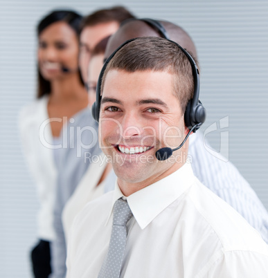 Cheerful customer service representatives standing in a line