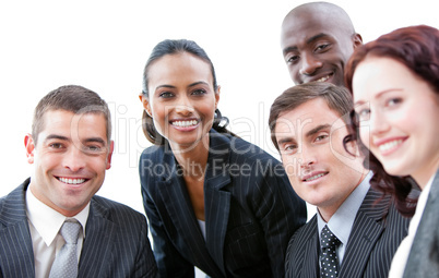 Multi-ethnic business people smiling at the camera in a meeting