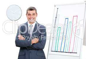 Cheerful businessman with folded arms doing a presentation