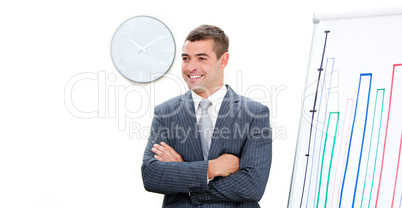 Young businessman with folded arms doing a presentation