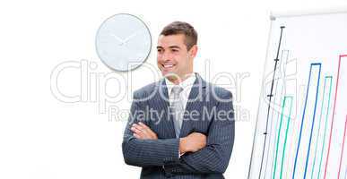 Young businessman with folded arms doing a presentation