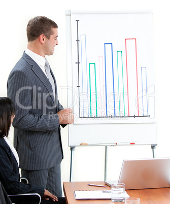 Attractive young businessman doing a presentation