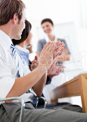 Jolly business people applauding a good presentation