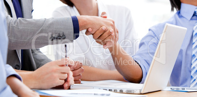 Close-up of business partners shaking hands