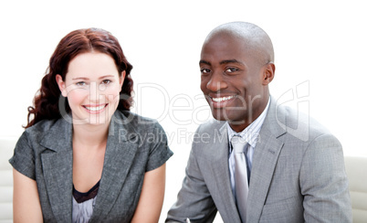 Two business partners smiling at the camera