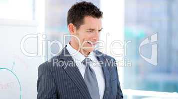Portrait of a charismatic businessman at a presentation