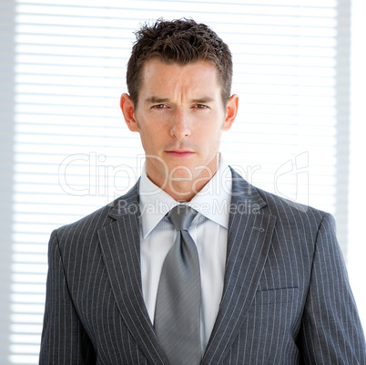 Portrait of a charismatic businessman standng