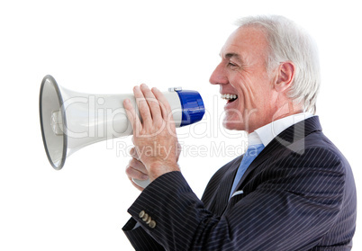 Senior smiling businessman using a megaphone