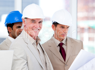 Smiling architect team working on a building project