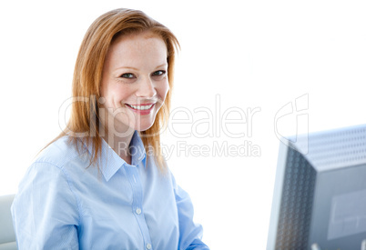 Radiant business woman working on a computer