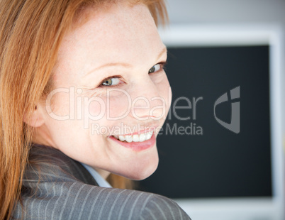 Self-assured business woman working on a computer