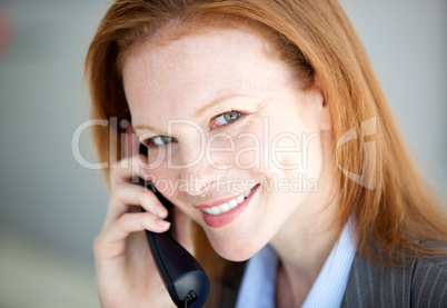 Self-assured business woman taking a call