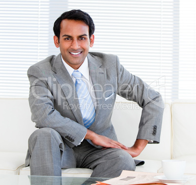 Handsome businessman sitting on the sofa
