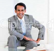 Handsome businessman sitting on the sofa