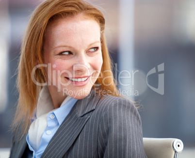 Nice business woman looking behind her